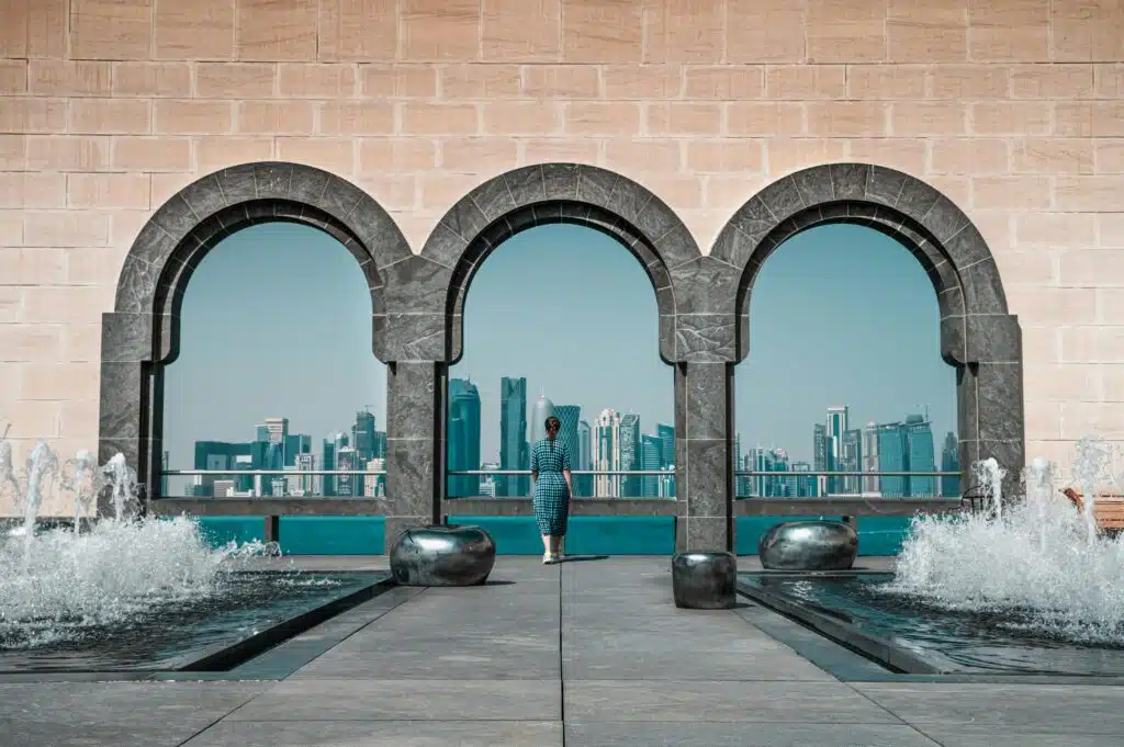 View of Doha skyline through Islamic arches at Museum of Islamic Art, Qatar.