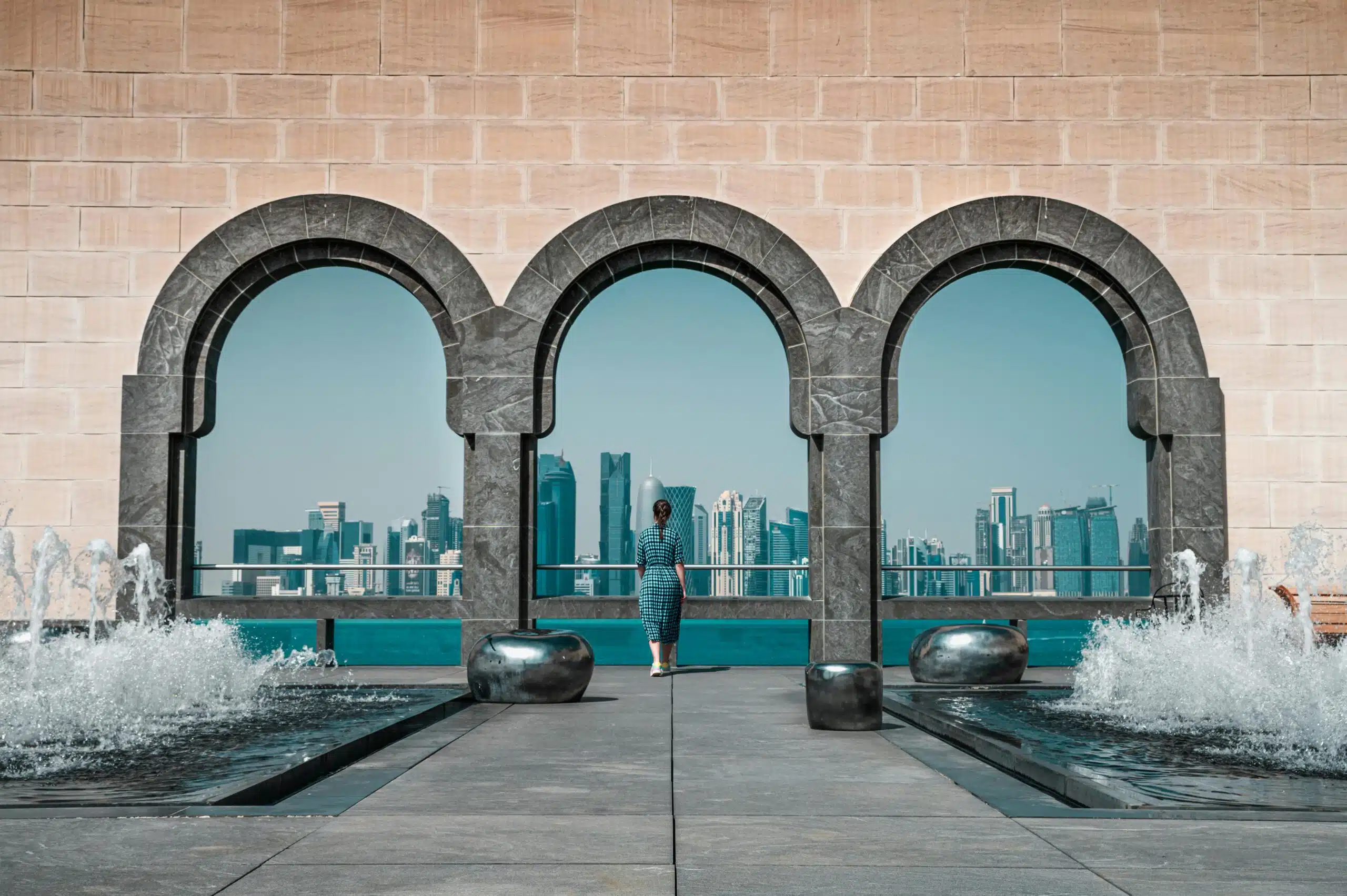 View of Doha skyline through Islamic arches at Museum of Islamic Art, Qatar.