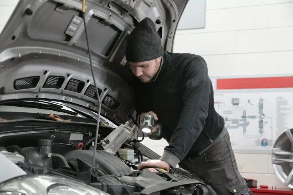 A mechanic working on a car